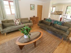 A living room with two sofas, a coffee table, and a plant at Yonde View Camborne