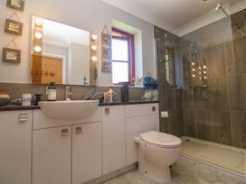 A bathroom with a sink, toilet, and shower at Yonde View in Camborne
