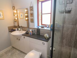 A bathroom with a sink and shower at Yonde View in Camborne