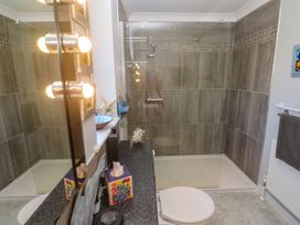 A bathroom with a shower and sink at Yonde View Camborne