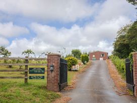 An entrance with a gate and a sign at Shepherds Hut at East Hill Pride Four Elms Hill Nr. Sidmouth