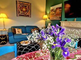 A living room with a sofa and coffee table at Flat 3 in Llandudno