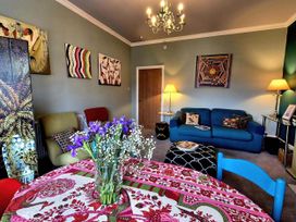 A living room with artworks and furniture at Flat 3 in Llandudno