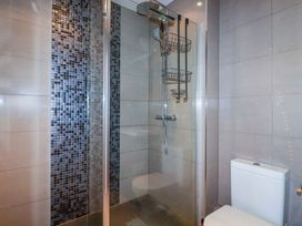 A bathroom with a shower and toilet at Trewollock in Mevagissey