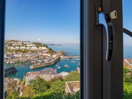A view of a harbor with boats and houses at Trewollock in Mevagissey