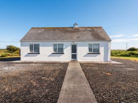 A house with a pathway in front at Golf Club View, County Clare