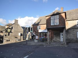 A building with a sign at the corner of a street at Little Wickers in Wareham
