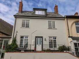 A house with multiple windows and a door at Flat 1 Harley House in Sidmouth