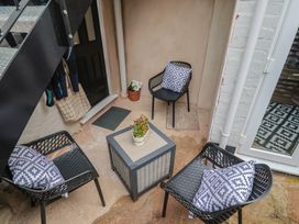 An outdoor area with chairs and a table at Flat 1 Harley House Sidmouth