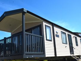 A mobile home with a balcony and windows at 619 Chy-An-Mor Perranporth