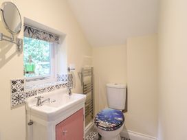 A bathroom with a sink and toilet at Hay Loft at Ebenezer Chapel Milwr