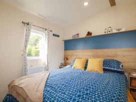 A bedroom with a bed and window at 5 Silverbow
