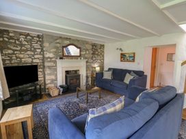 A living room with sofas and a fireplace at Tegfan in Newport