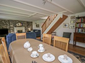 A dining room with a table set for tea at Tegfan in Newport