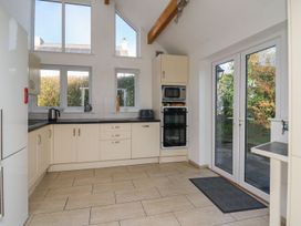 A kitchen with a fridge and oven at Tegfan in Newport