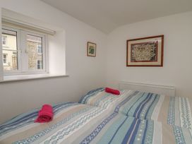 A bedroom with two beds and a window at Tegfan in Newport