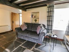 A living room with a sofa and coffee table at Brigg House Broughton-in-Furness