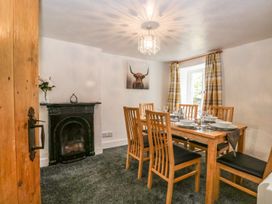 A dining room with a table and chairs at Brigg House Broughton-in-Furness