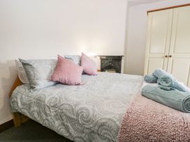 A bedroom with a bed and pillows at Brigg House in Broughton-in-Furness