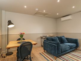 A living room with a sofa and table at Foxglove in Stratton Audley near Bicester