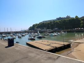 A marina with boats in water and a dock at Sandpiper Narberth