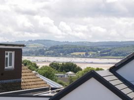 A view of hills and boats from rooftops at Halsdon Avenue, Exmouth