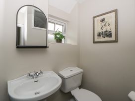 A bathroom with a sink and toilet at Arosfa in New Quay