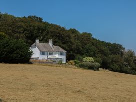 A house with a garden and trees at The White House in Okehampton
