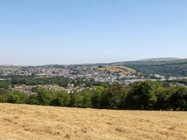 A view of houses and fields in the countryside at The White House in Okehampton