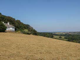 A house on a hillside surrounded by fields at The White House in Okehampton
