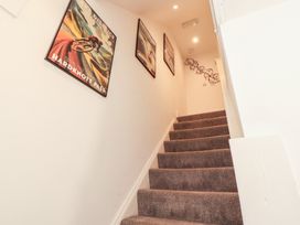 A staircase with posters on the wall at Hidden Gem in 