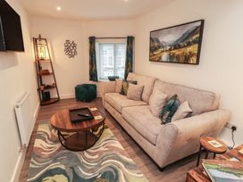 A living room with a sofa and coffee table at Hidden Gem in 