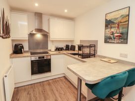 A kitchen with modern fixtures and appliances at Hidden Gem