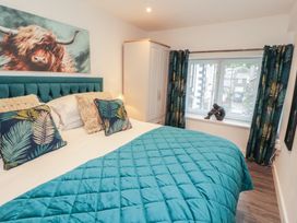 A bedroom with a bed and a wardrobe at Hidden Gem