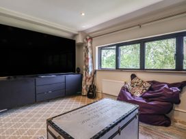 A snug with a television and a bean bag at Mayflower Cottage in Lyme Regis