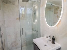 A bathroom with a shower and sink at Mayflower Cottage in Lyme Regis