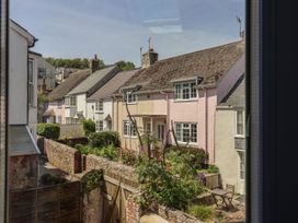 A view of houses with gardens and pathway at Mayflower Cottage in Lyme Regis