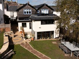 A house with a garden and outdoor table at Mayflower Cottage Lyme Regis