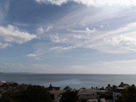 A view of the ocean and houses at Mayflower Cottage Lyme Regis
