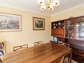 A dining room with a table and chairs at Number 10, Broadway