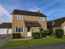 A house with a garage and front garden at Number 10, Broadway
