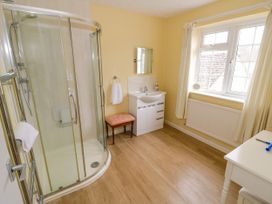 A bathroom with shower and washbasin at Number 10, Broadway