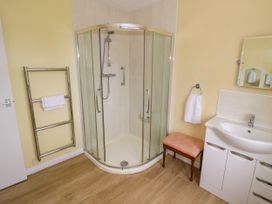 A bathroom featuring a shower and washbasin at Number 10, Broadway