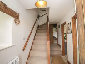 A staircase in a hallway at Over Brow Cottage in Coniston