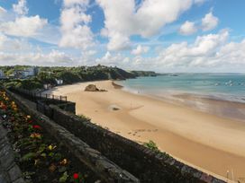 A beach with water and boats at Sea Suite in 