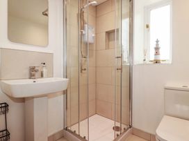 A bathroom with a shower and sink at Little House in Wadebridge