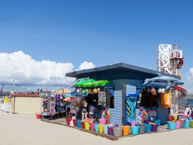 A beach kiosk selling swim gear and toys at Ocean Breeze in Weymouth