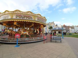 A carousel with horses at Ocean Breeze in Weymouth