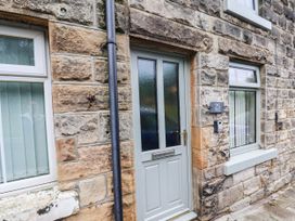 A door and windows of a stone house at The Snug Glaisdale