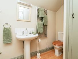 A bathroom with a sink and toilet at The Snug Glaisdale